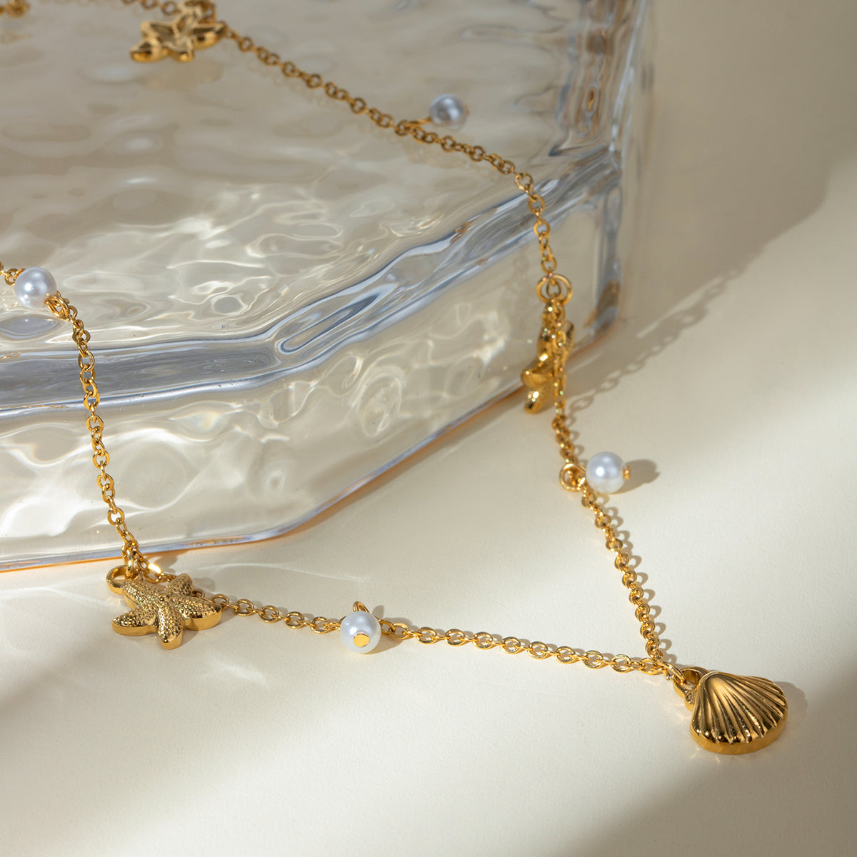 Dainty Seashell and Starfish Charm Necklace with Pearl Accents - Nuriale