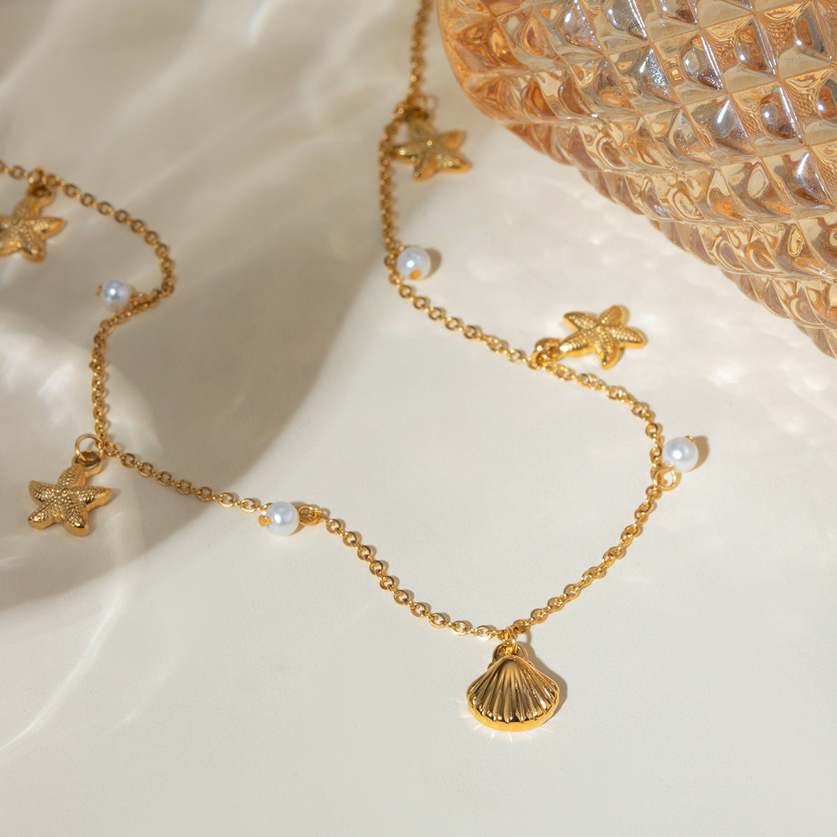 Dainty Seashell and Starfish Charm Necklace with Pearl Accents - Nuriale
