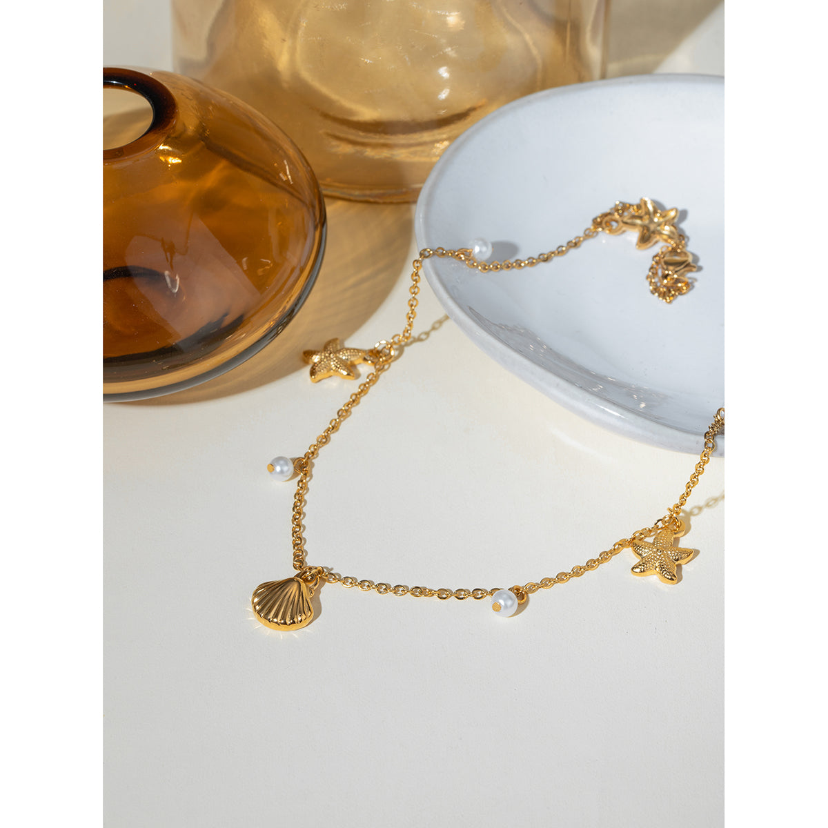 Dainty Seashell and Starfish Charm Necklace with Pearl Accents - Nuriale